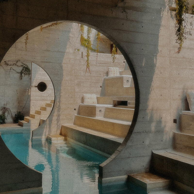 Sun-drenched coastal landscape in Puerto Escondido, Oaxaca, Mexico; capturing slow travel, off-grid architecture, and the importance of hydration and electrolytes in extreme tropical heat.
