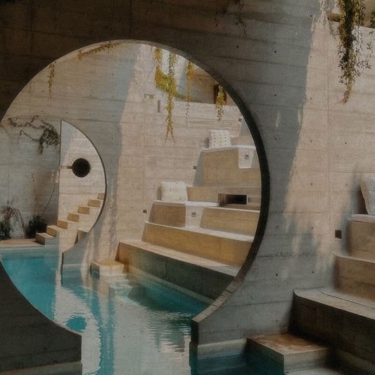 Sun-drenched coastal landscape in Puerto Escondido, Oaxaca, Mexico; capturing slow travel, off-grid architecture, and the importance of hydration and electrolytes in extreme tropical heat.