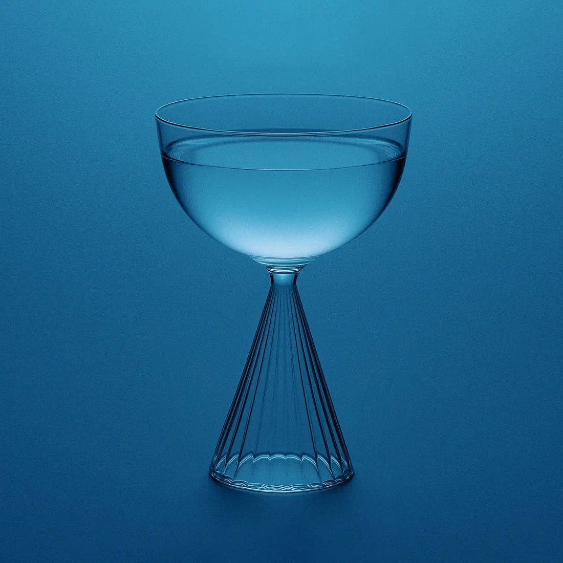 Electrolyte water in an elegant glass representing premium hydration; highlights the role of sodium, potassium, and magnesium malate in energy production, muscle function, heart health, and stress relief through advanced electrolyte balance.